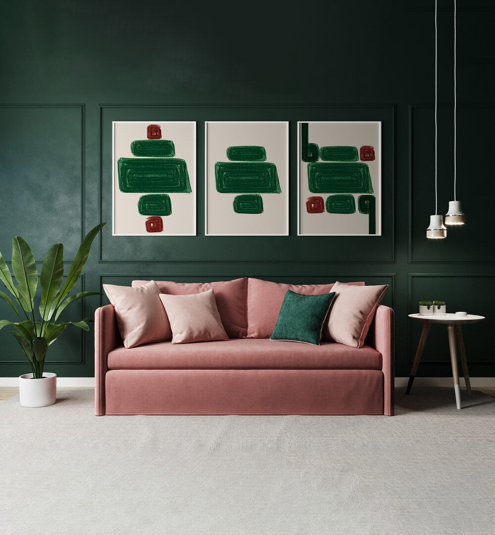 Stunning EMERALD SET, SET OF 3 PAINTINGS displayed above a chic pink sofa, enhancing elegant home decor.