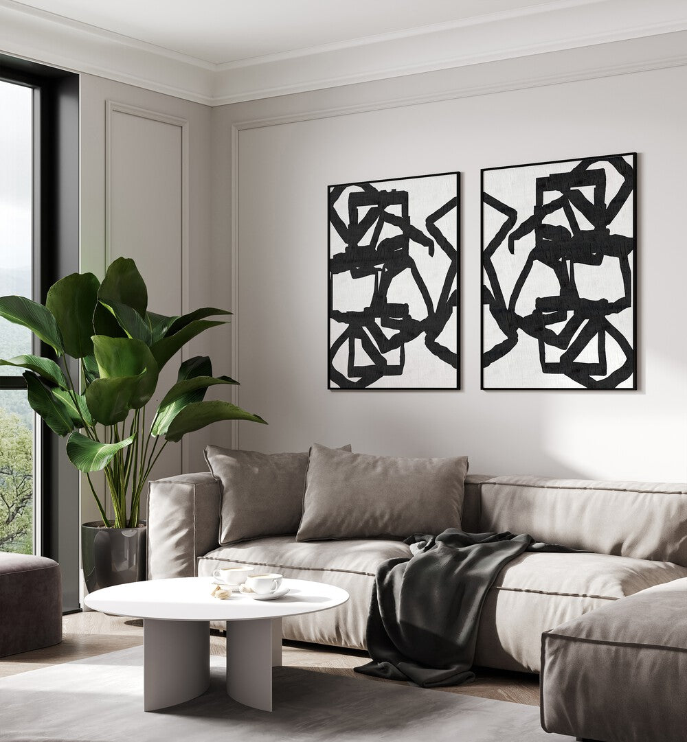 Sophisticated living room featuring the ENTANGLED FORMS SET, SET OF 2 PAINTINGS with intricate black patterns.
