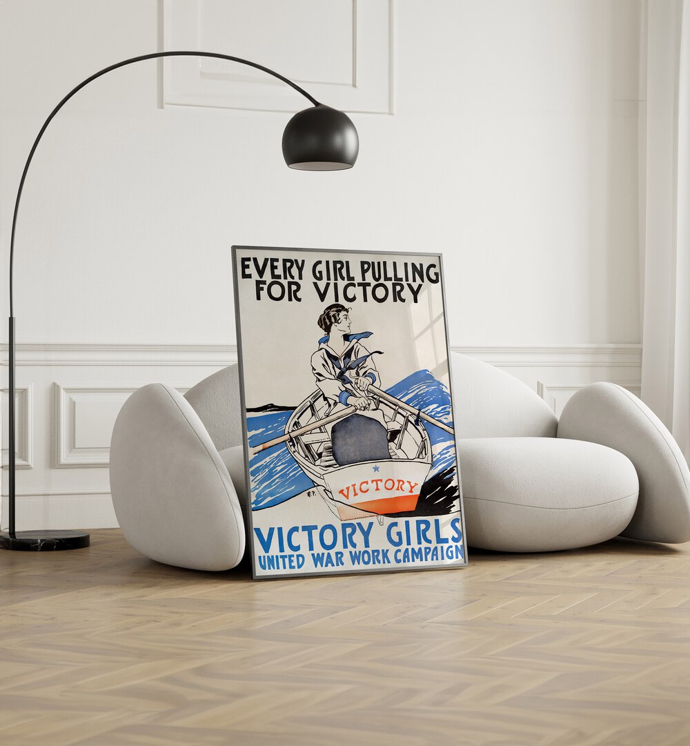 Every Girl Pulling For Victory, Victory Girls United War Work Campaign 1918 Vintage Paintings in Black Plain Frame placed on the floor beside a sofa