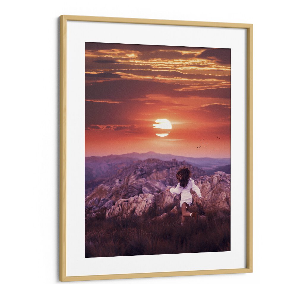 "FREE SPIRIT, SURREAL ART PRINTS showcases a child dancing at sunset, framed beautifully to enhance any decor."