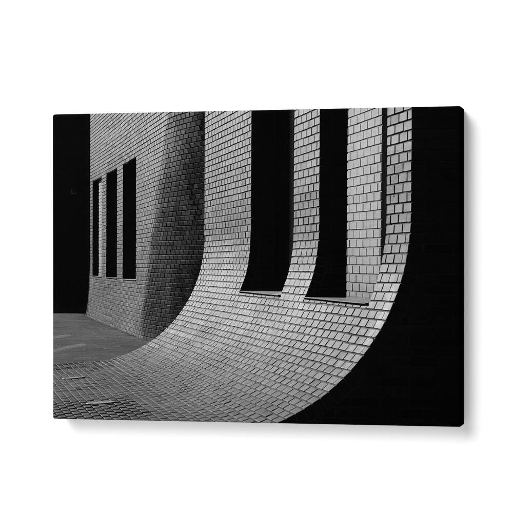 Urban architecture meets art in UNTITLED VI, PHOTOGRAPHY PRINTS, showcasing striking brick patterns and curves.