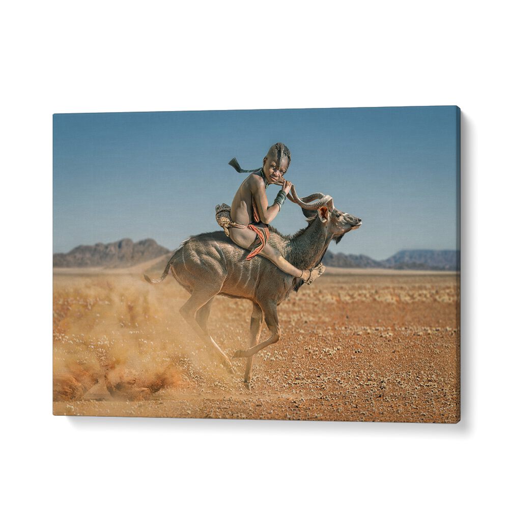 A young rider on a kudu in the wild captures the spirit of EASY RIDER, PHOTOGRAPHY PRINTS collection.