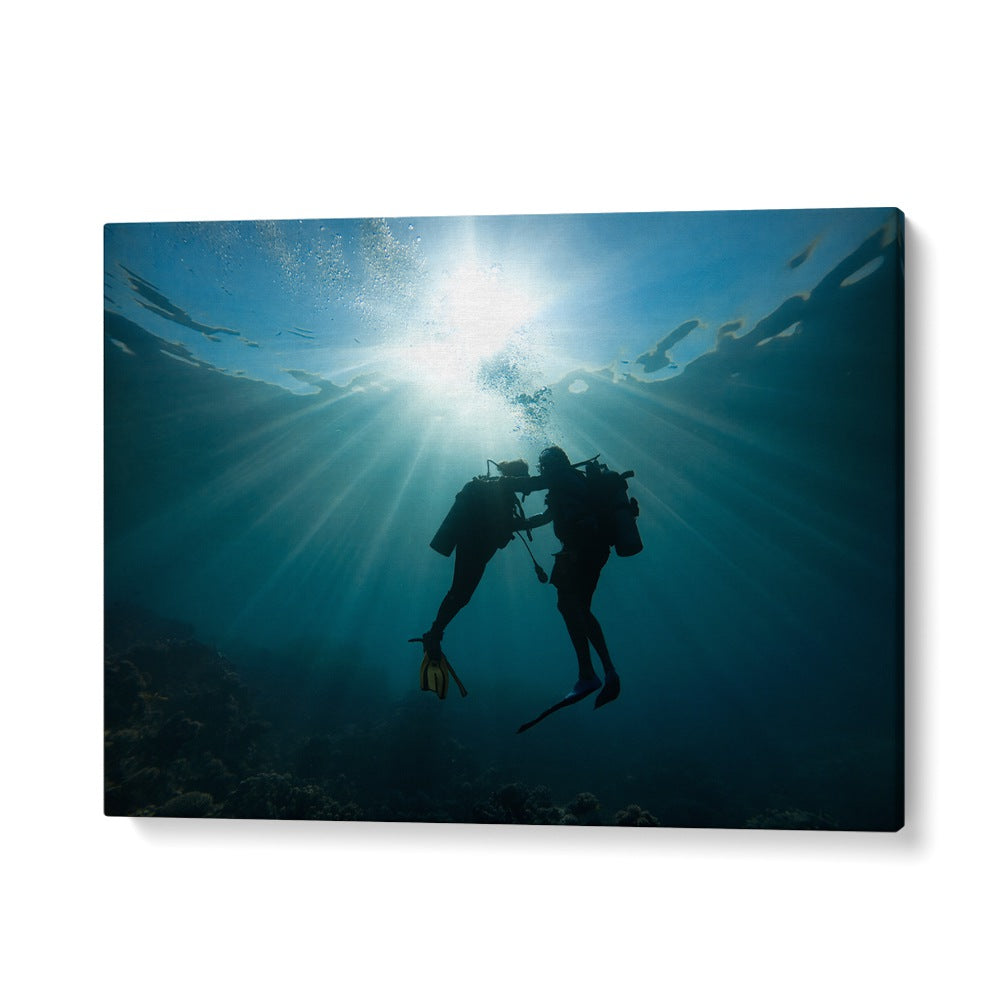 Underwater scene capturing two divers against a radiant sunbeam, showcasing TRUST ME, PHOTOGRAPHY PRINTS collection.