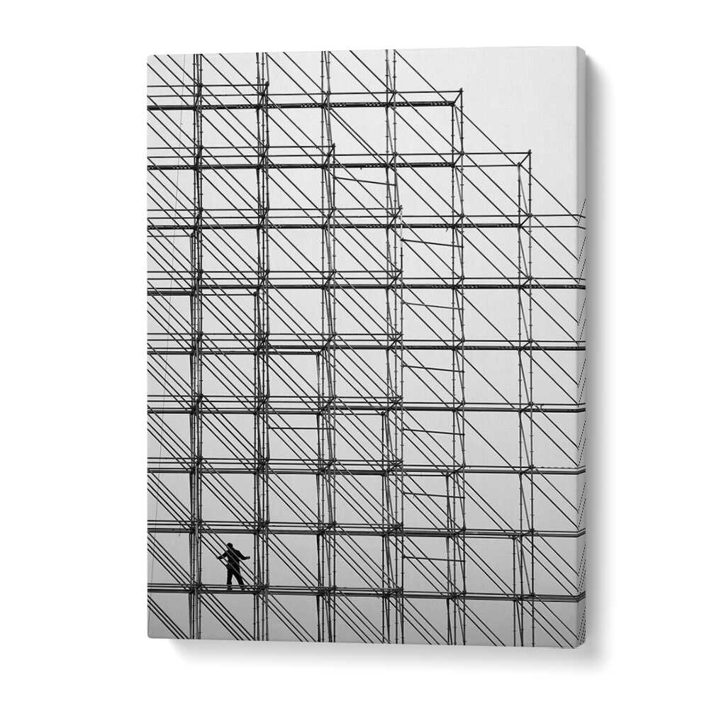 CUBE, PHOTOGRAPHY PRINTS showcase a striking black-and-white composition featuring a figure among scaffolding.
