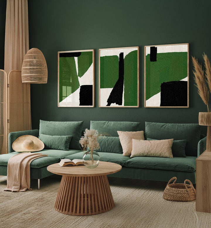 Stylish living room showcasing the GREEN BLACK OIL ABSTRACT SET, SET OF 3 PAINTINGS, perfect for modern decor.