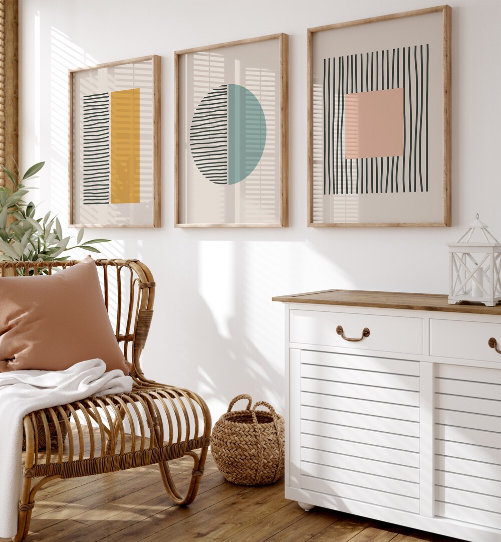 Stylish living space featuring the GEOMETRIC DUALITY SET, SET OF 3 PAINTINGS with vibrant geometric shapes.