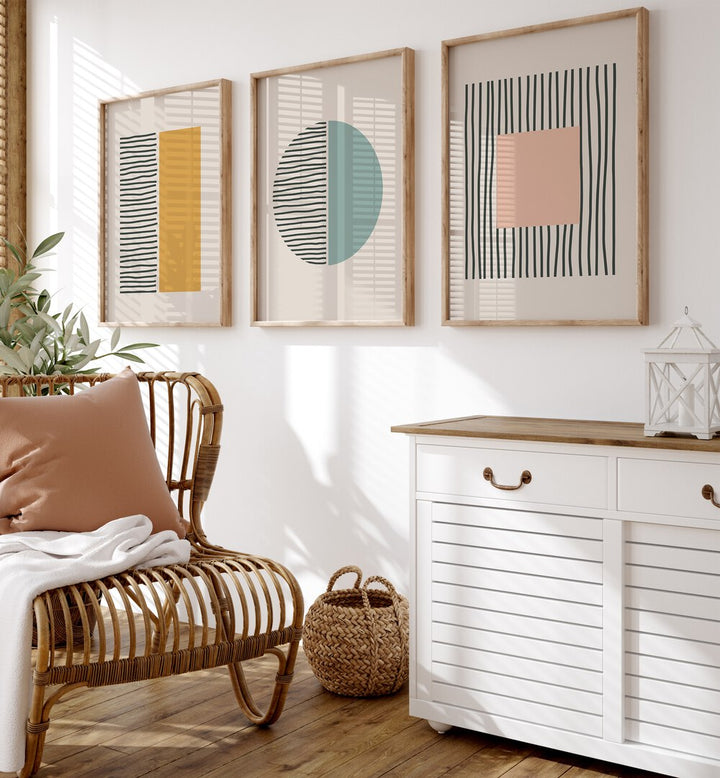 Stylish living space featuring the GEOMETRIC DUALITY SET, SET OF 3 PAINTINGS with vibrant geometric shapes.