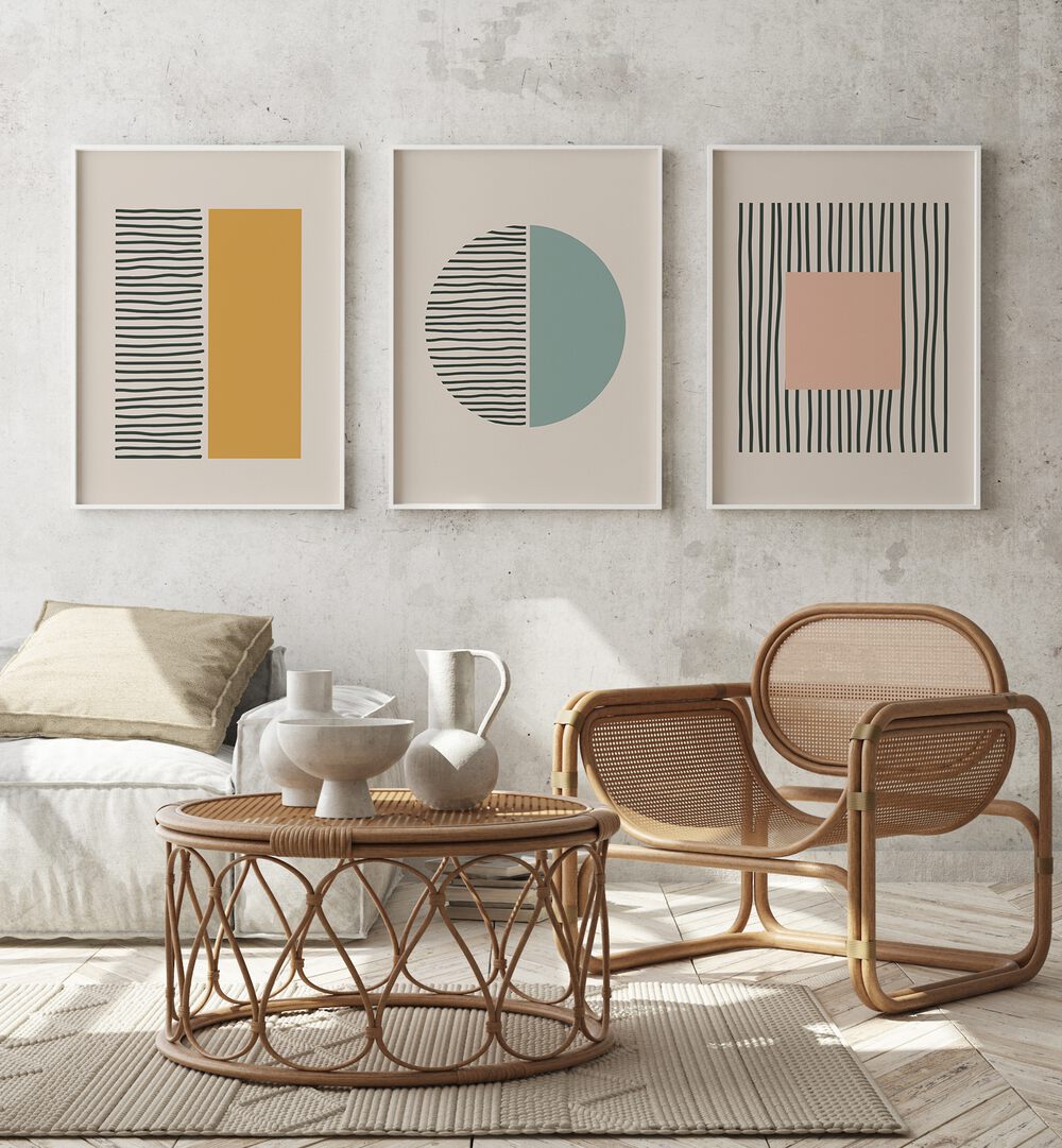 Modern living space showcasing the GEOMETRIC DUALITY SET, SET OF 3 PAINTINGS, highlighting vibrant geometric designs.