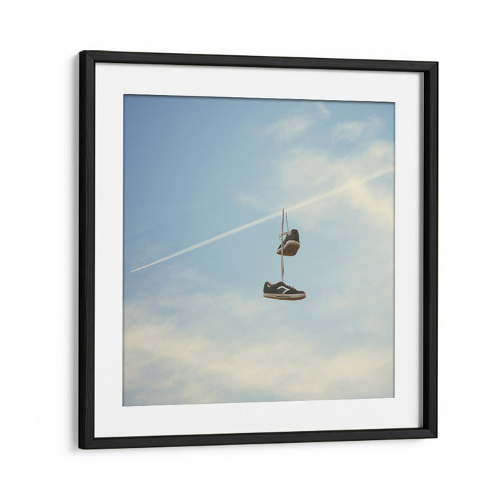 Hang N There surreal painting by Vertigo Artography features sneakers suspended against a serene sky, embodying surreal art.