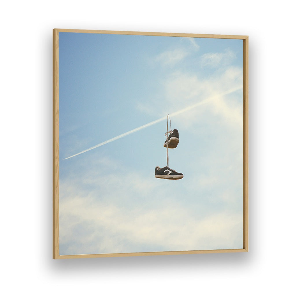 HANG N THERE SURREAL PAINTING, SURREAL ART features hanging shoes against a blue sky, perfect for any art lover's space.