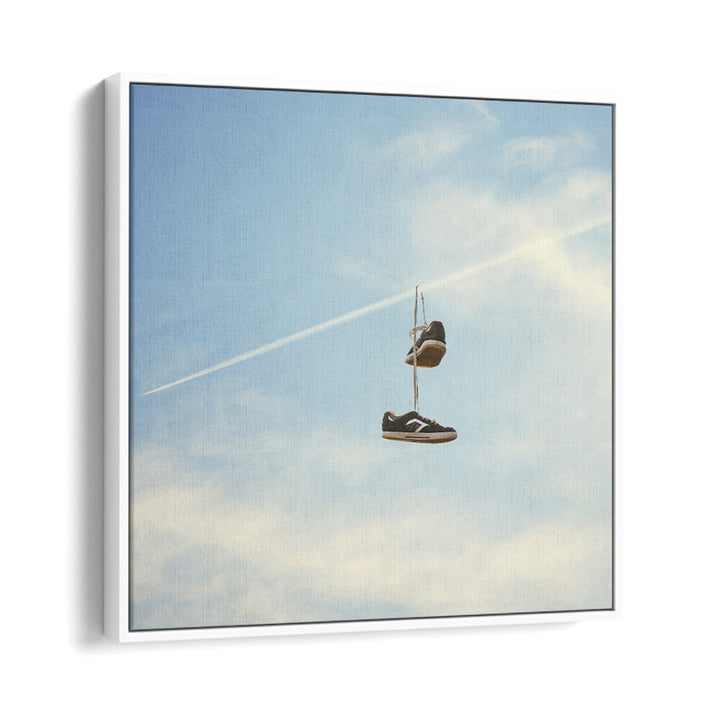 HANG N THERE SURREAL PAINTING, SURREAL ART showcases hanging shoes against a blue sky, perfect for modern decor.