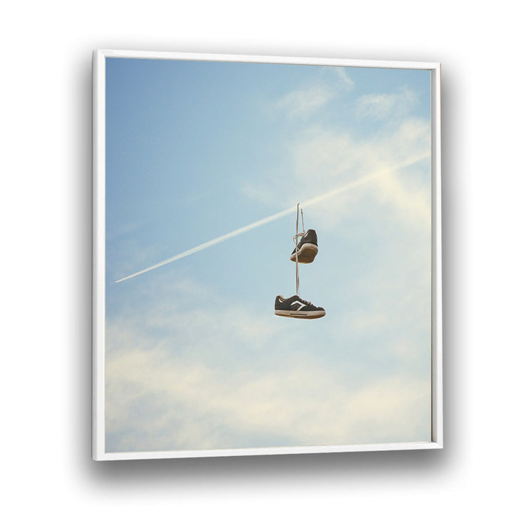 HANG N THERE SURREAL PAINTING, SURREAL ART featuring hanging shoes against a blue sky, crafted by Vertigo Artography.