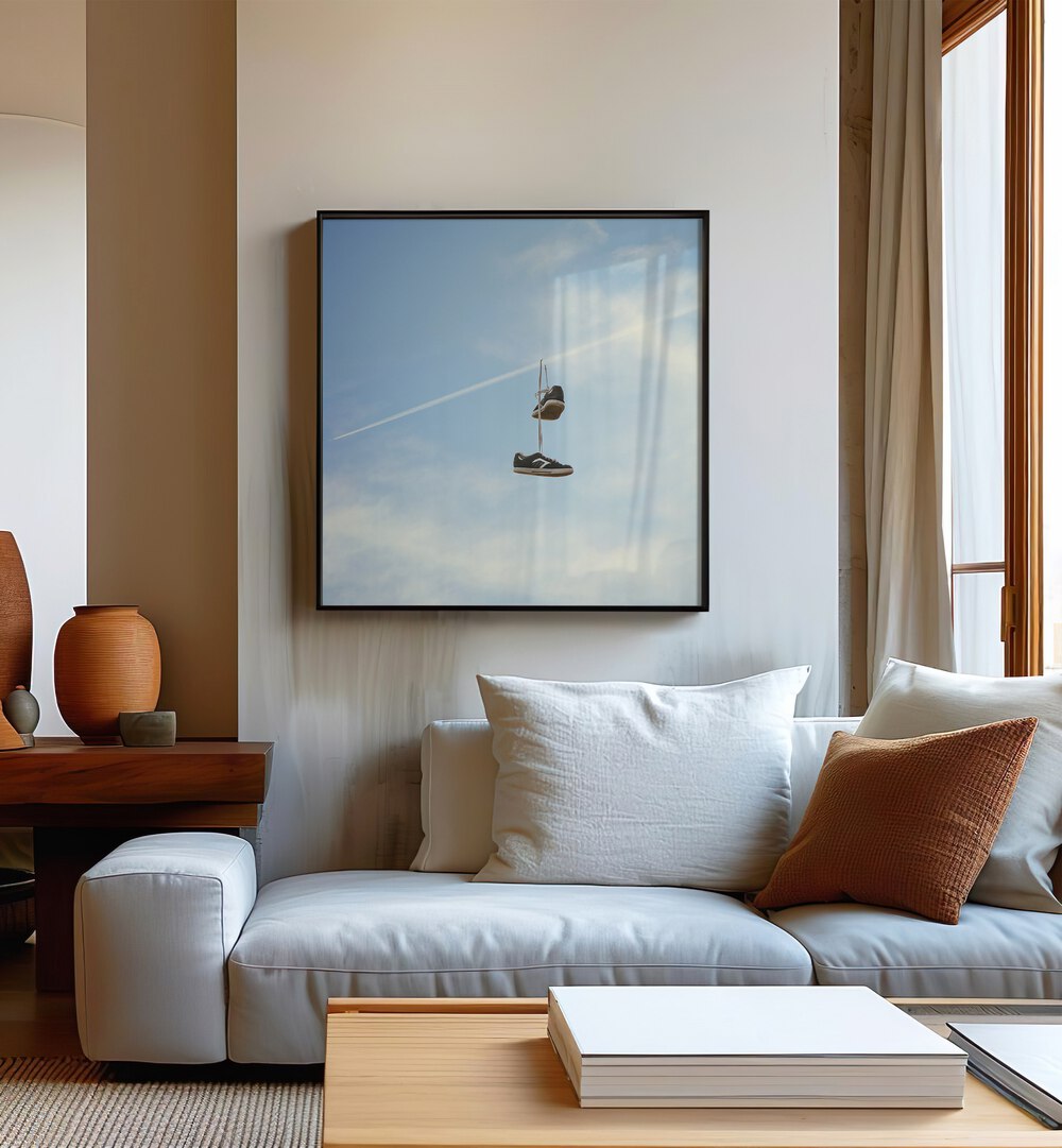 Stylish living room featuring "Hang N There" surreal painting, surreal art on canvas by Vertigo Artography.