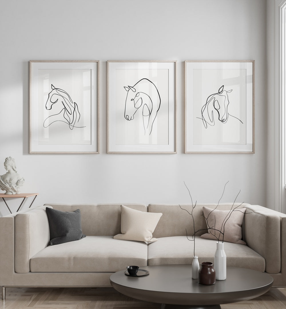 Elevate your decor with the HORSES LINE ART SET, SET OF 3 PAINTINGS from Asianmonk, showcasing elegant horse line drawings.