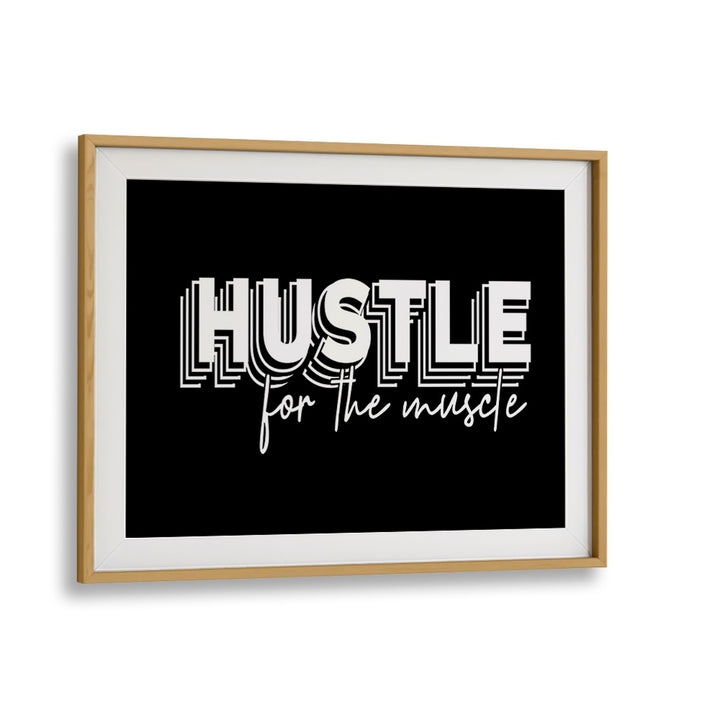 HUSTLE FOR THE MUSCLE, QUOTES poster in a sleek oak frame, perfect for inspiring fitness enthusiasts.