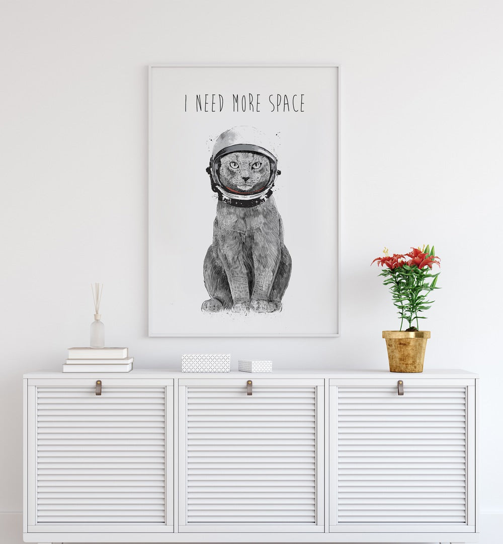 Whimsical cat astronaut artwork declaring "I Need More Space" perfect for fantasy lovers. Ideal for your home decor.