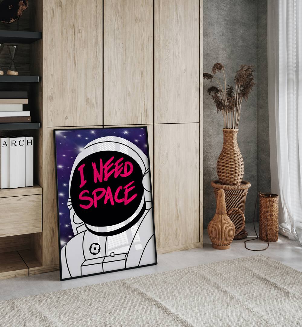 I Need Space Astronaut & Nasa Paintings, Space Art Prints Artwork in Black Plain Frame placed on a Floor near a Wooden Cabinet  in the Drawing Room