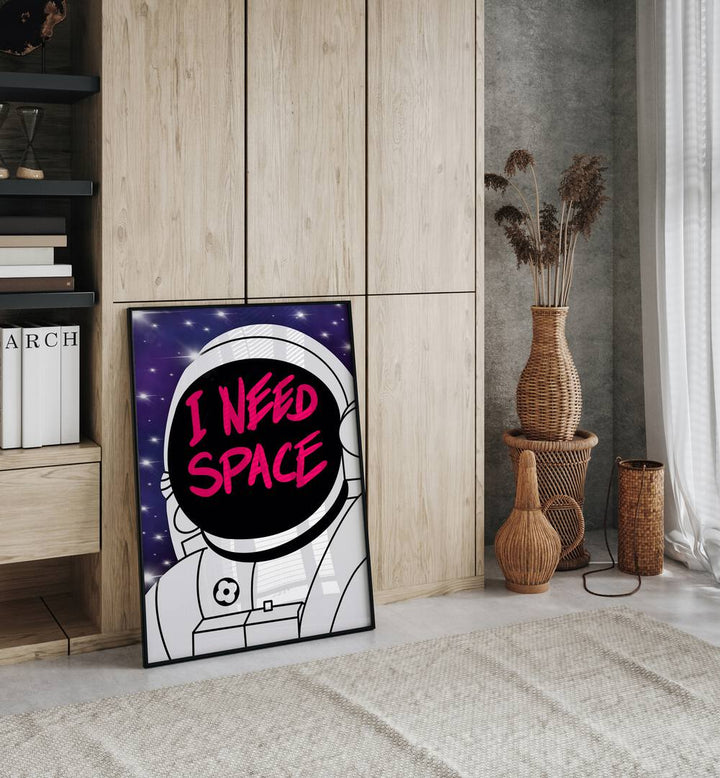 I Need Space Astronaut & Nasa Paintings, Space Art Prints Artwork in Black Plain Frame placed on a Floor near a Wooden Cabinet  in the Drawing Room