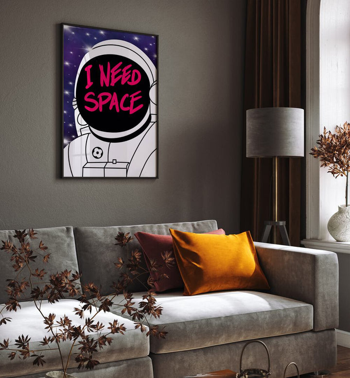 I Need Space Astronaut & Nasa Paintings, Space Art Prints Artwork in Black Plain Frame placed on a Grey Colored Wall near a Sofa in the Living Room