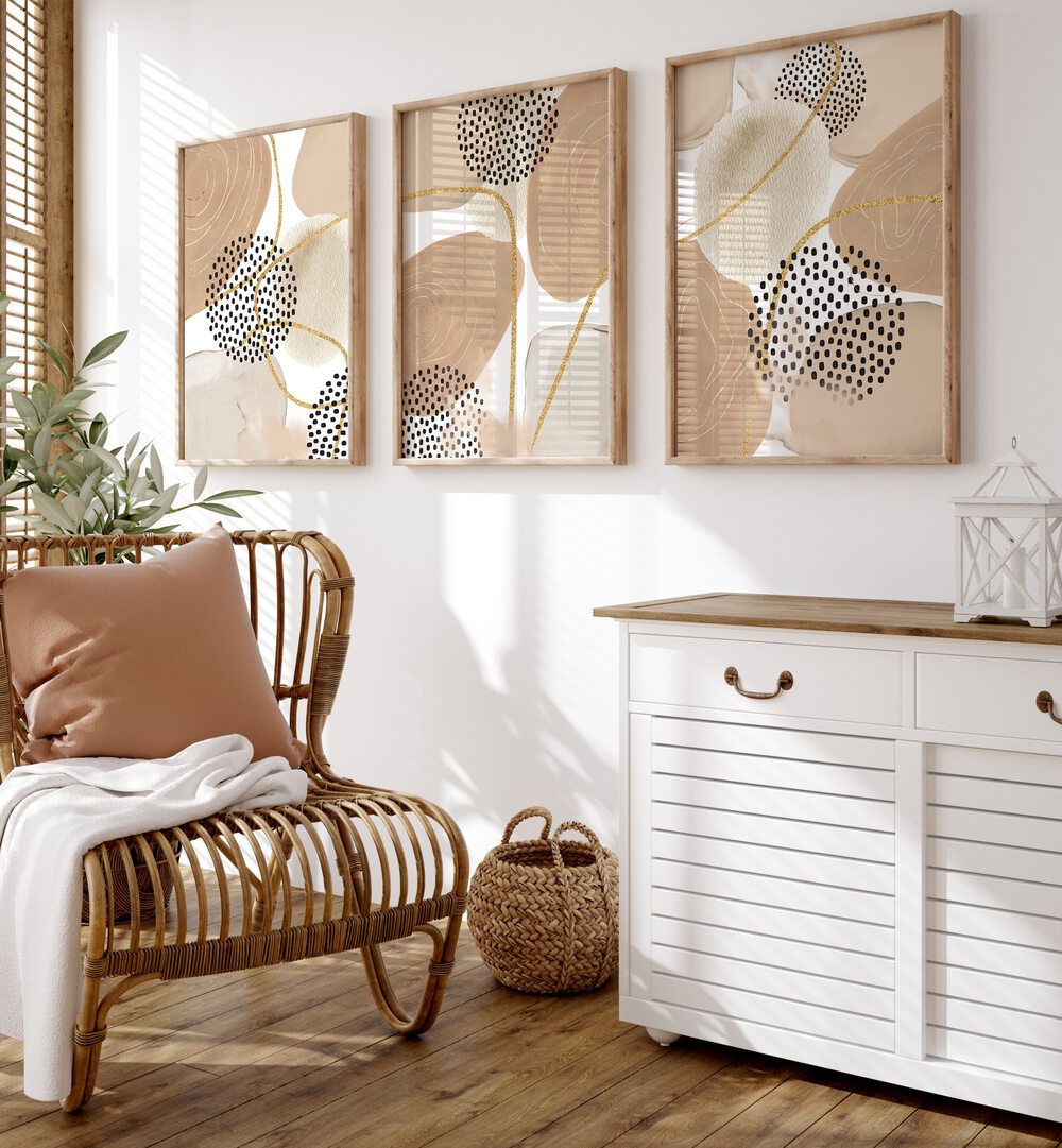 Stylish living room featuring the JEALOUS BEIGE SET, SET OF 3 PAINTINGS, adding elegance to any space.