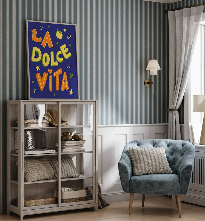 Bright and colorful LA DOLCE VITA, QUOTES poster by Studio Dolci, enhancing a stylish living space.