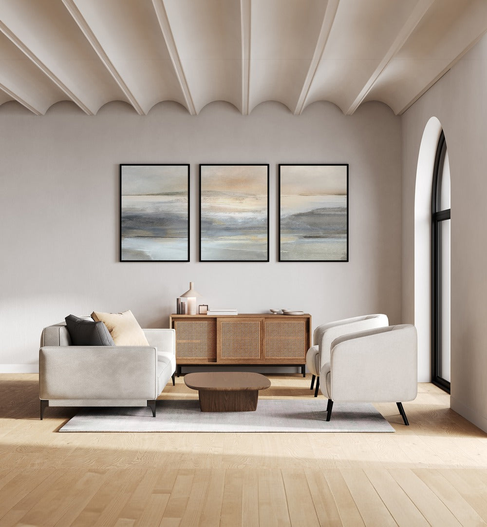 Stylish living room featuring the LANDSCAPE ABSTRACTION SET, SET OF 3 PAINTINGS by Dan Hobday for modern elegance.