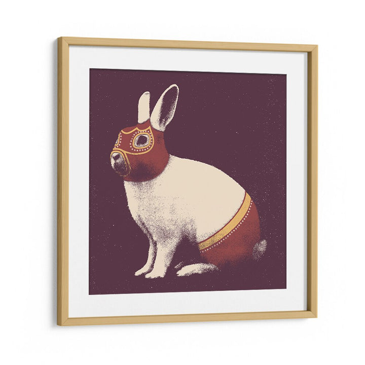 Framed LAPIN CATCHEUR, ANIMAL PAINTINGS featuring a whimsical rabbit design in vibrant colors and a modern oak frame.