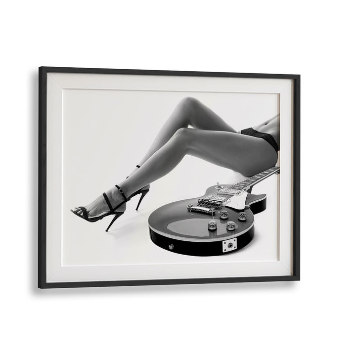 Stylish LEGGY LES PAUL, PHOTOGRAPHY PRINTS by David Drake, showcasing art and fashion in a captivating black frame.