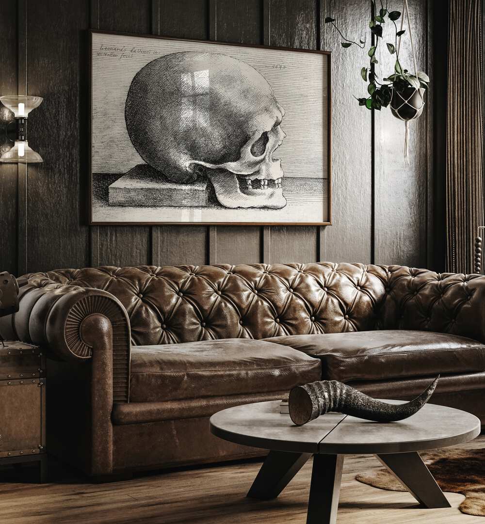 Leonardo Da Vincis Skull In Profile To Right 1645 Vintage Paintings in Dark Oakwood Plain Frame placed on a wall behind a brown sofa