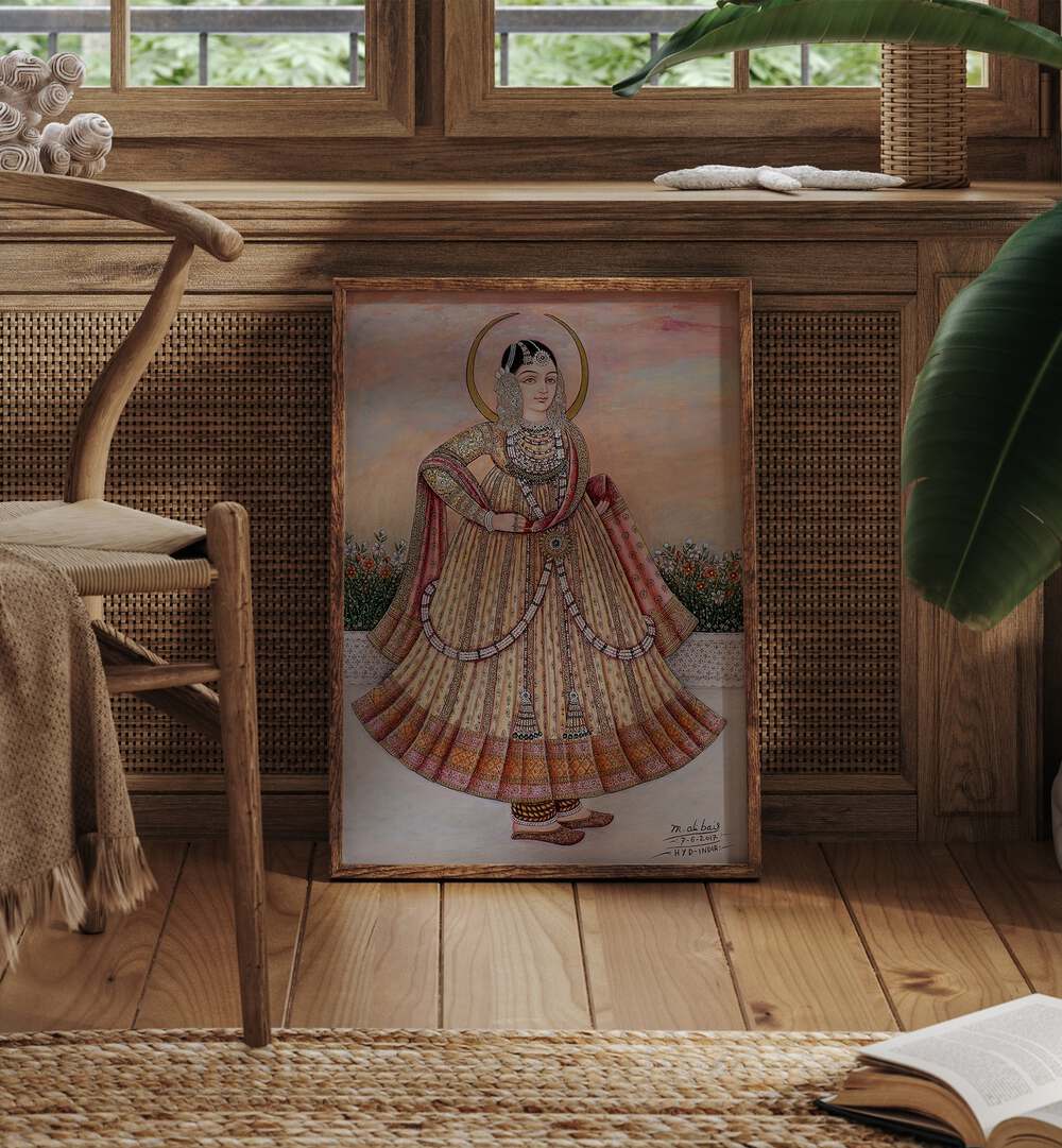 Mehlakha Bai Chanda Artwork Indian Art Painting Artwork in oakwood plain frame next to a chair