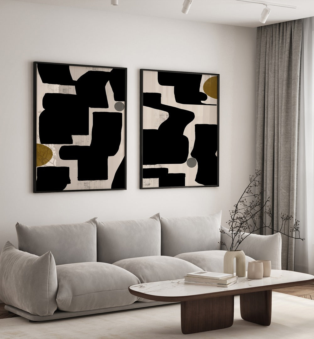 Stylish living room featuring the MONOCHROME RHYTHM SET, SET OF 2 PAINTINGS, enhancing modern decor with elegance.