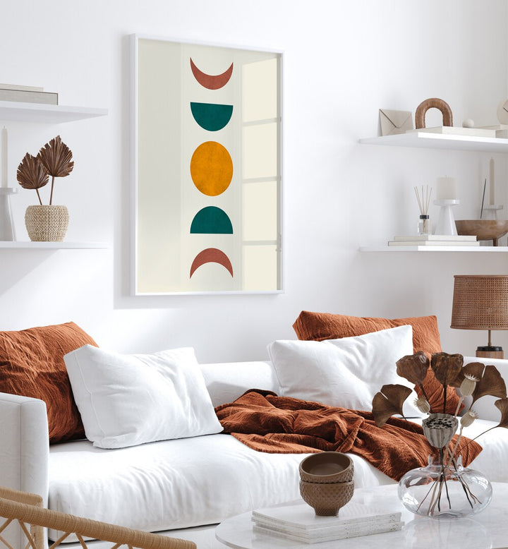 Stylish living room featuring MOON PHASES II, BOHO ART PAINTINGS, enhancing decor with lunar elegance.