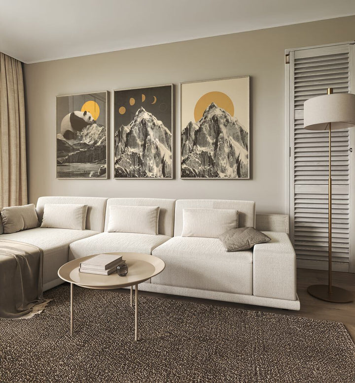Stylish living room featuring the MOUNTAINSCAPE MOONPHASE SET, SET OF 3 PAINTINGS against a neutral backdrop.