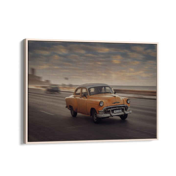 Capture the essence of street life with MALECON VII, PHOTOGRAPHY PRINTS featuring a vintage yellow car in motion.