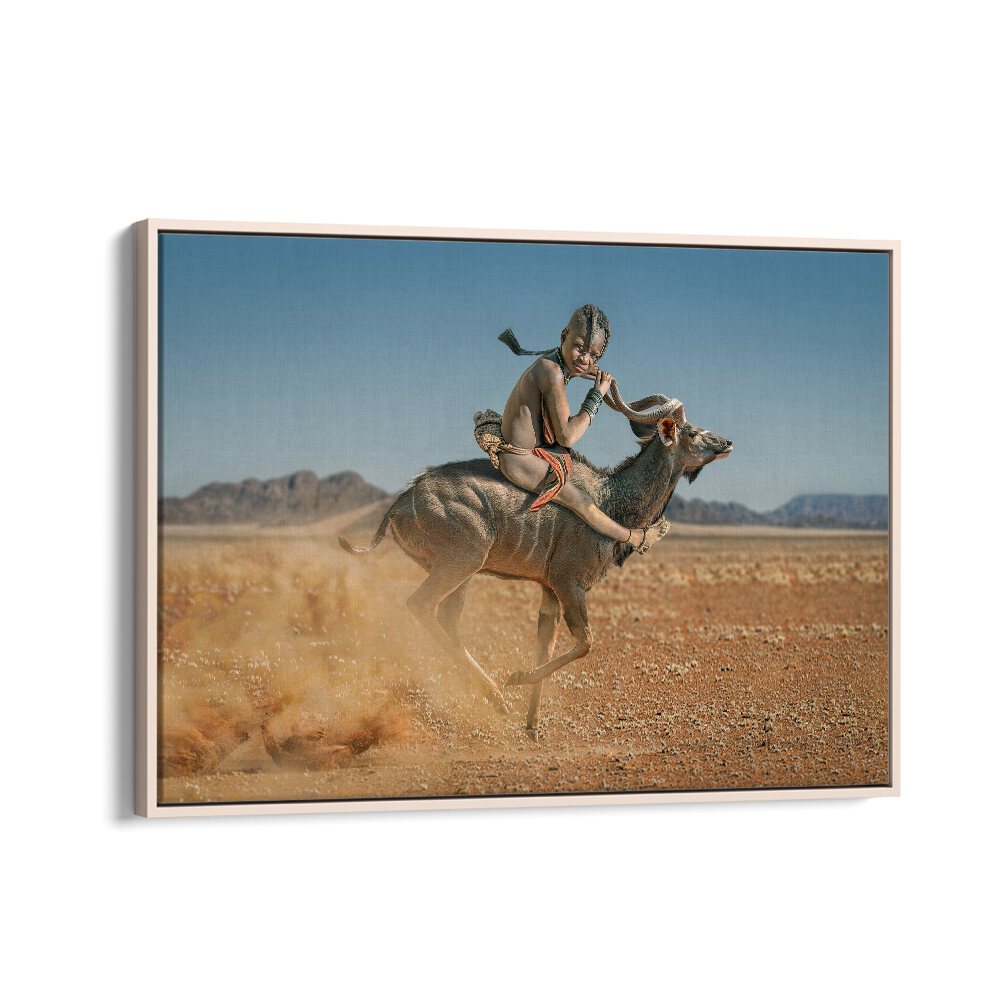 Captivating EASY RIDER, PHOTOGRAPHY PRINTS showcasing a child riding a gazelle in a stunning wildlife landscape.