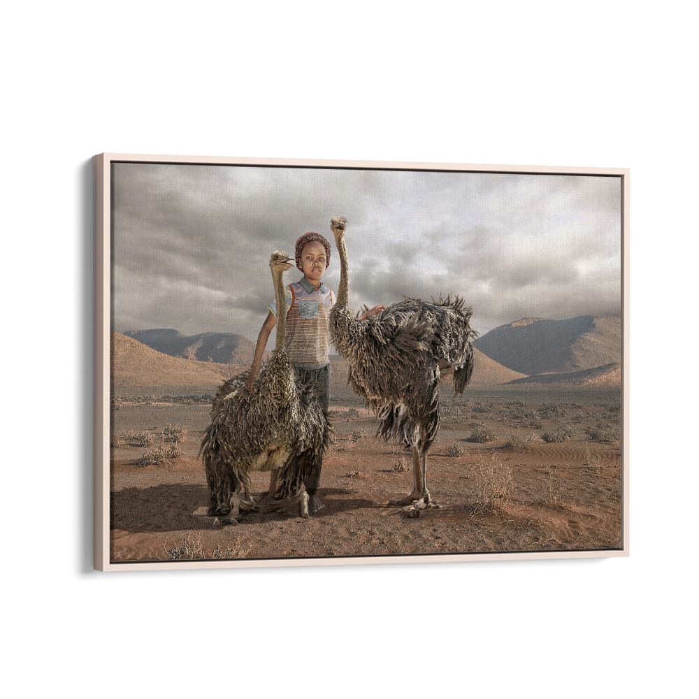Whimsical OSTRICH BOY, PHOTOGRAPHY PRINTS capturing surreal charm with a child and ostriches in a desert landscape.