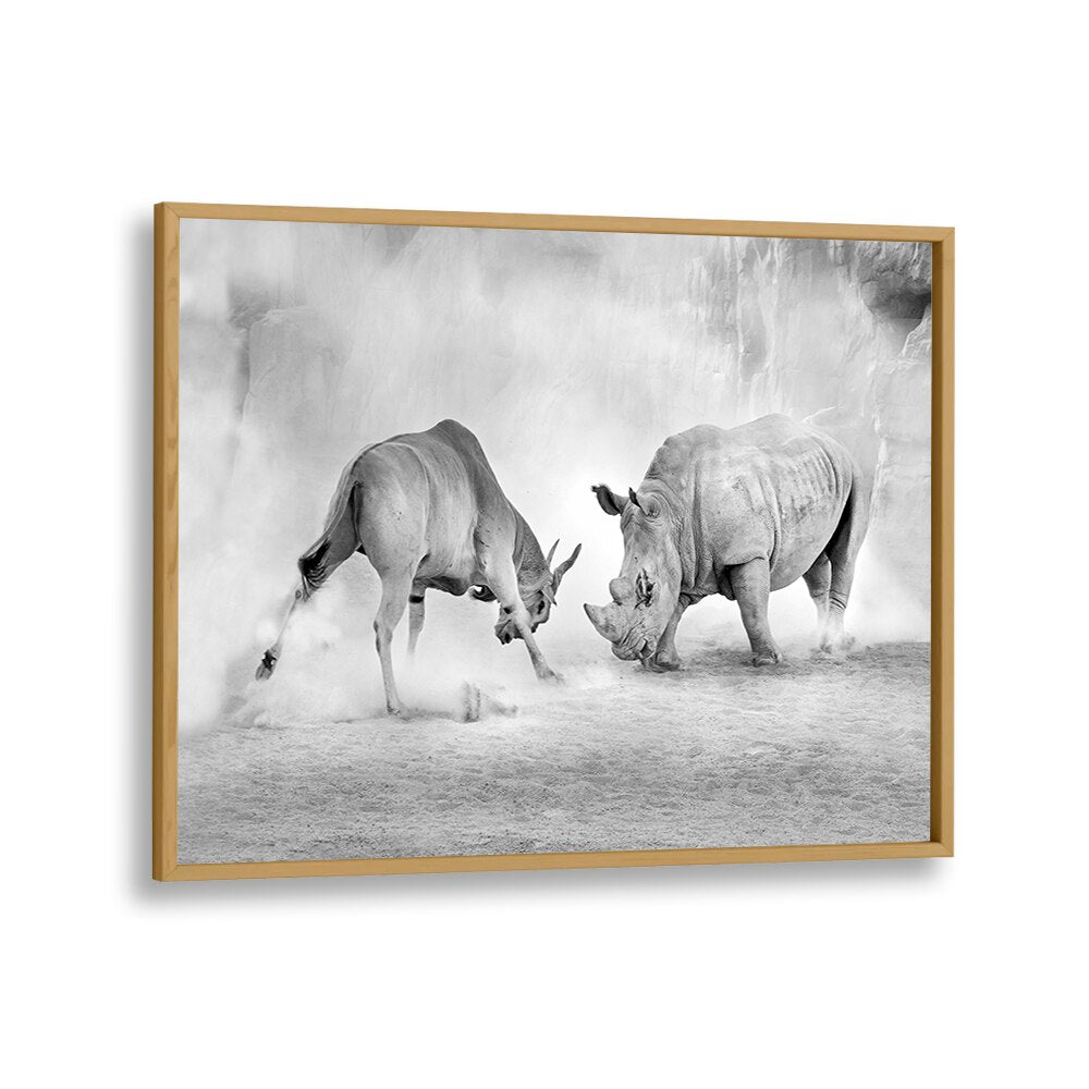 Combat, Photography Prints showcase a dramatic black-and-white scene of a rhinoceros and antelope in a natural setting.