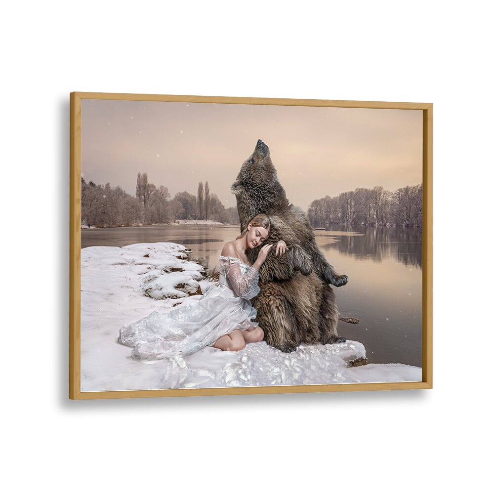 CUDDLING BEAR, PHOTOGRAPHY PRINTS feature a whimsical scene of a woman embracing a bear by a tranquil river.