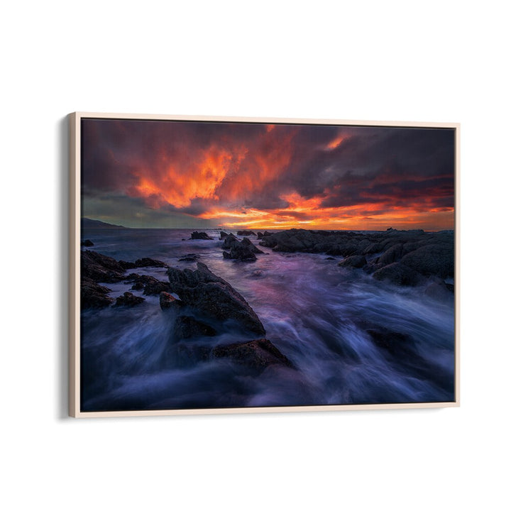 Stunning BURNING SKY, PHOTOGRAPHY PRINTS showcasing vibrant sunset over rocky shoreline, perfect for nature lovers.