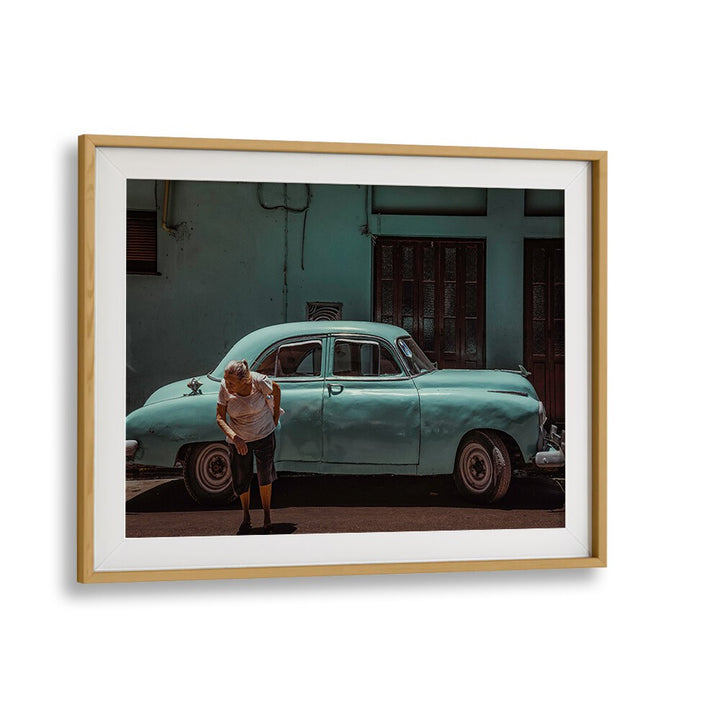 Explore urban life with PASSING STREET, PHOTOGRAPHY PRINTS, featuring a vibrant scene of a classic car and street life.