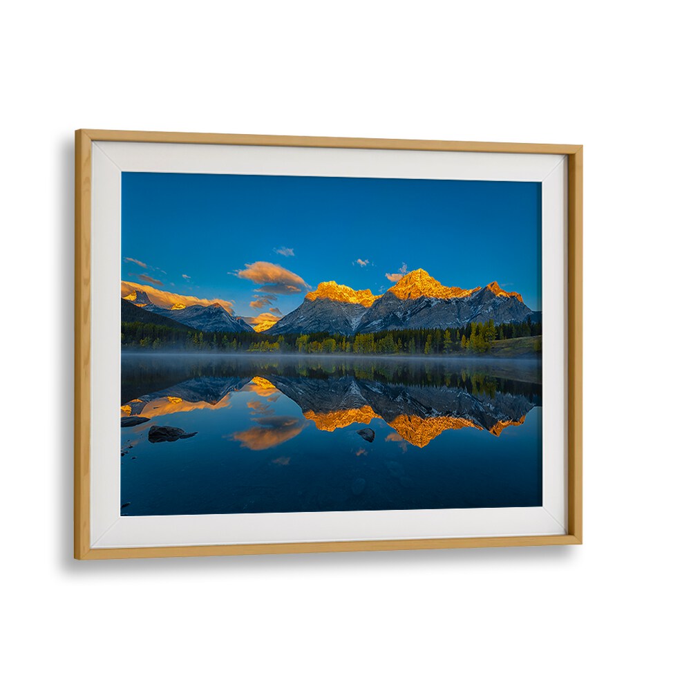 Stunning landscape reflecting dawn colors in the Canadian Rockies, perfect for photography prints and decor.