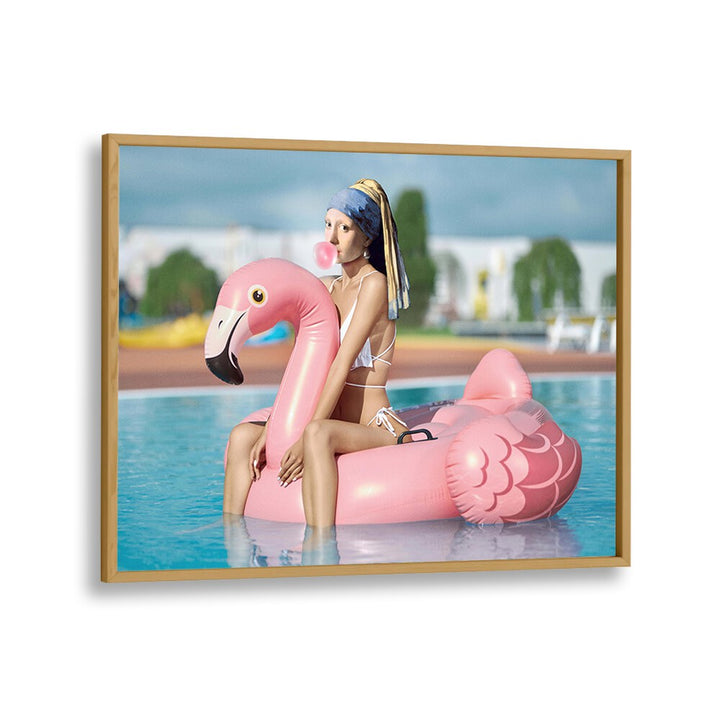 Relaxing by the pool, a model on a flamingo float showcases the SEXY PEARL, ALTERED ART PRINTS by DIKHOTOMY.