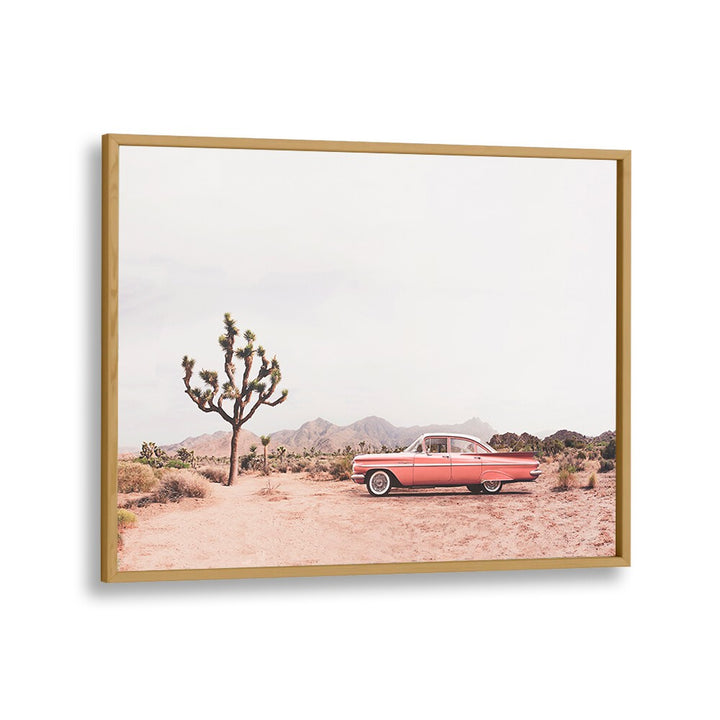 Discover the charm of "IN THE DESERT, COWBOY" featuring a vintage car against a stunning desert backdrop.