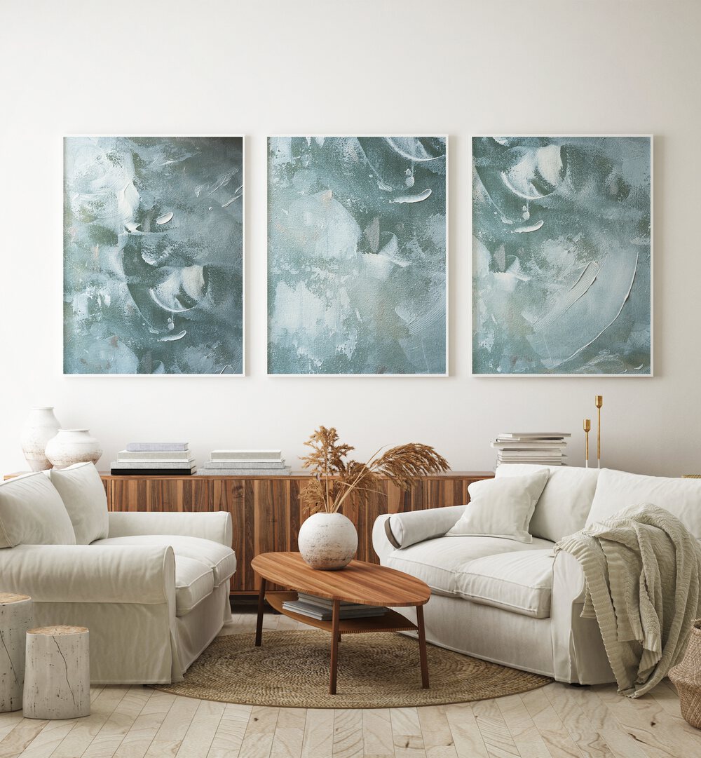 Transform your space with the OCEAN WHISPER SET, SET OF 3 PAINTINGS, featuring serene coastal artwork.