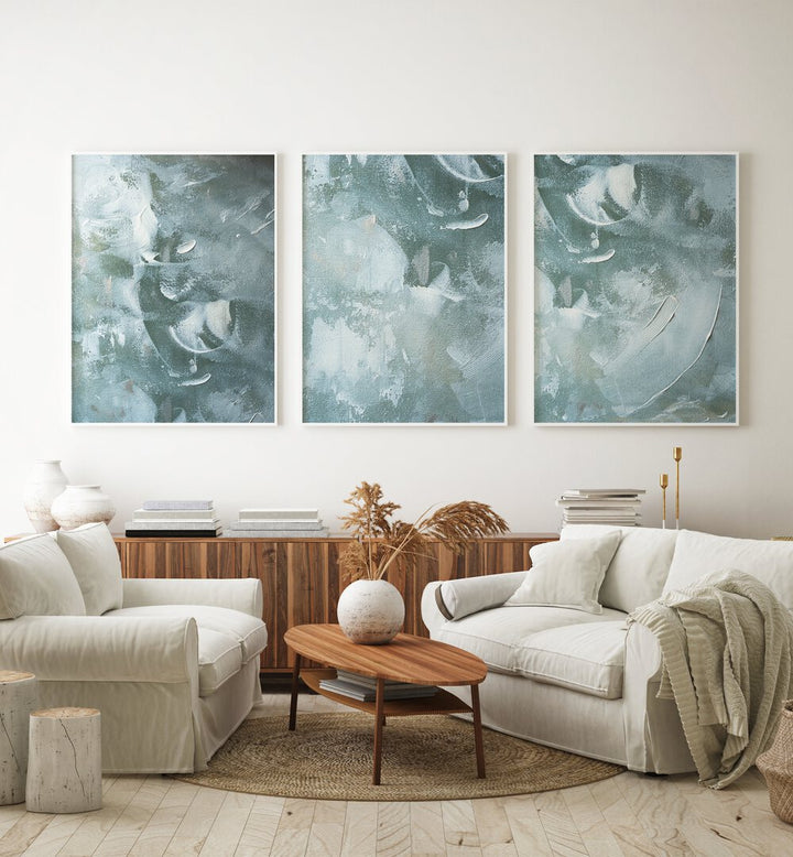 Transform your space with the OCEAN WHISPER SET, SET OF 3 PAINTINGS, featuring serene coastal artwork.