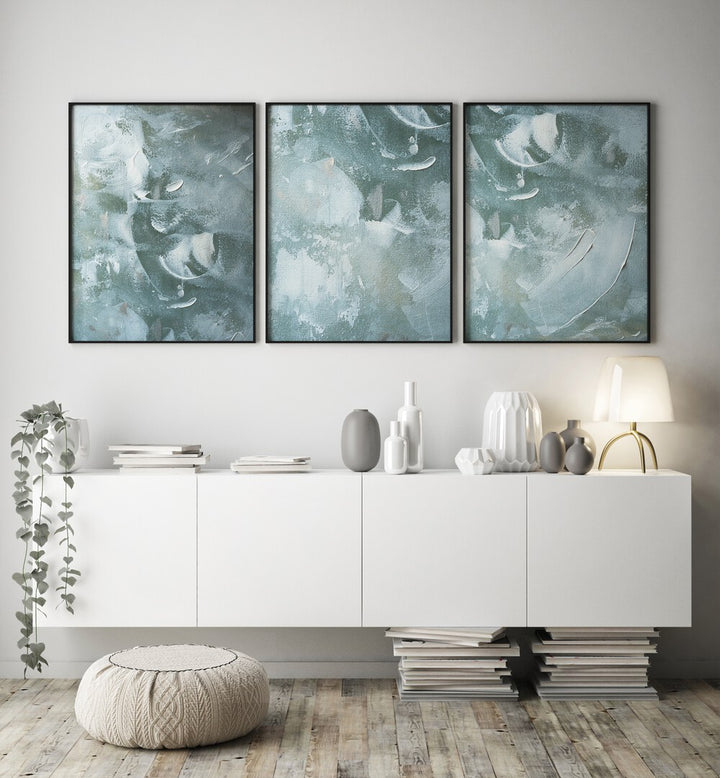 Transform your space with the OCEAN WHISPER SET, SET OF 3 PAINTINGS, showcasing serene coastal hues and textures.