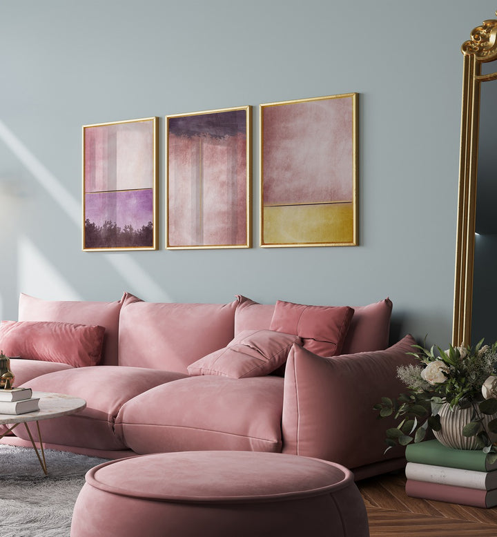 Stylish living room featuring the PLUM GOLD ABSTRACT SET, SET OF 3 PAINTINGS, enhancing elegance and sophistication.