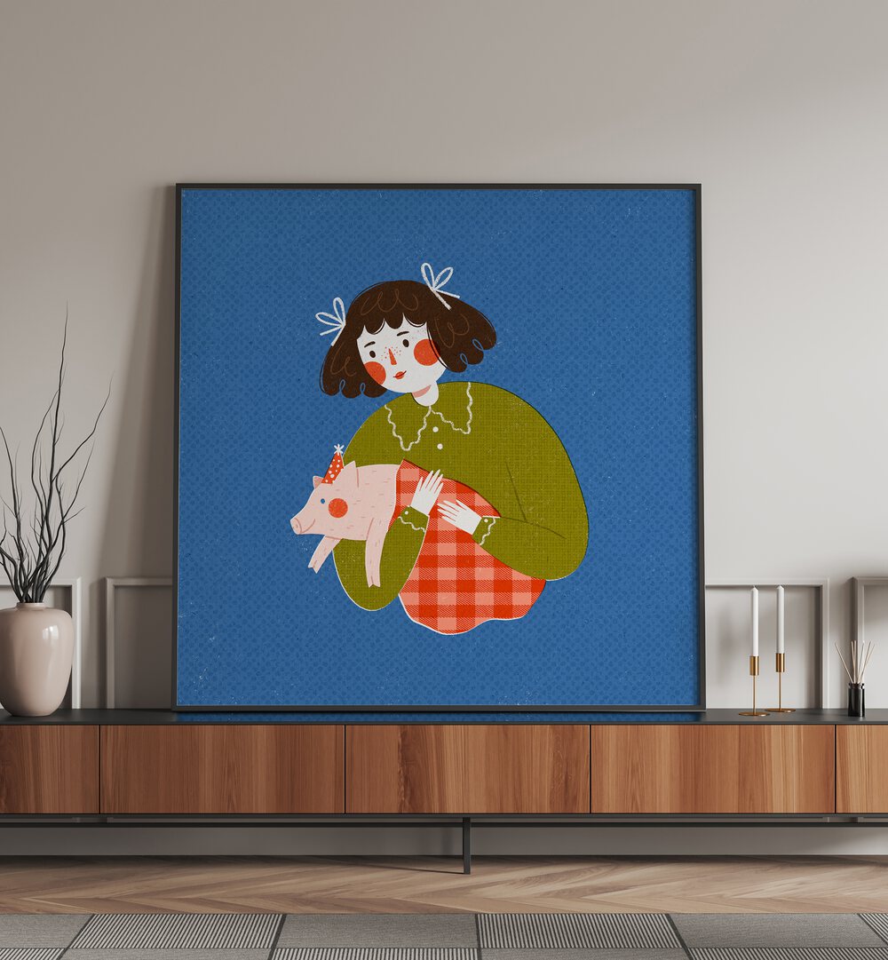 Piggie in the Blanket By Julia Leister Kids Room Art in Black Plain Frame placed on a console table