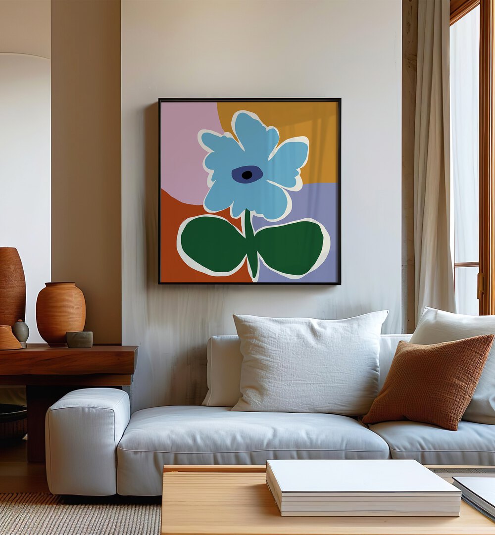 Retro Minimal Flower III, Botanical Art Paintings Artwork in Black Plain Frame placed on a Cream Colored Wall near a White Sofa in the Living Room