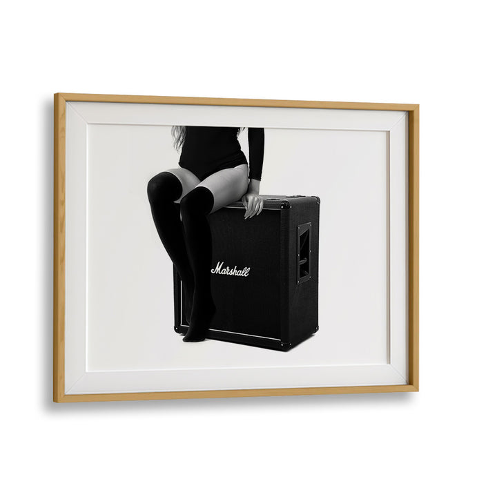 Stylish model perched on an amplifier, showcasing ROCK ME THE ULTIMATE, PHOTOGRAPHY PRINTS by David Drake.